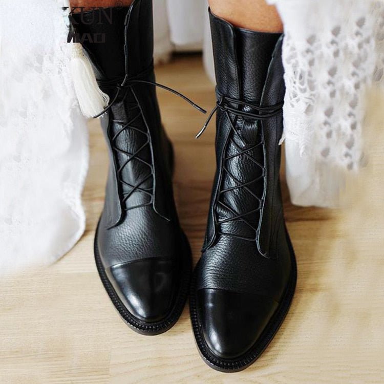 Botas elegantes de punta con tacón bloque